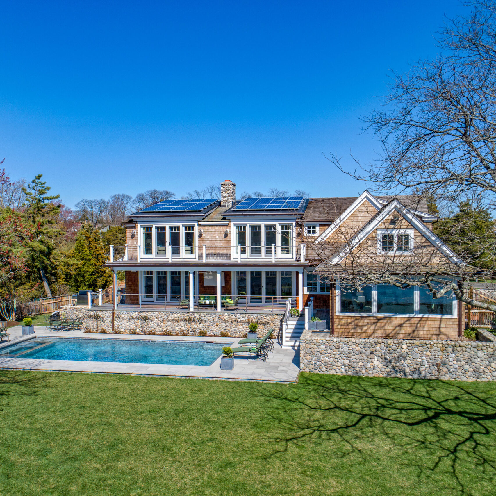 Home with solar panels built and designed by general contractors ERI Building in Design in Darien, CT